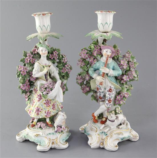 A pair of Derby candlestick figures, c.1770, 25.5cm, restorations